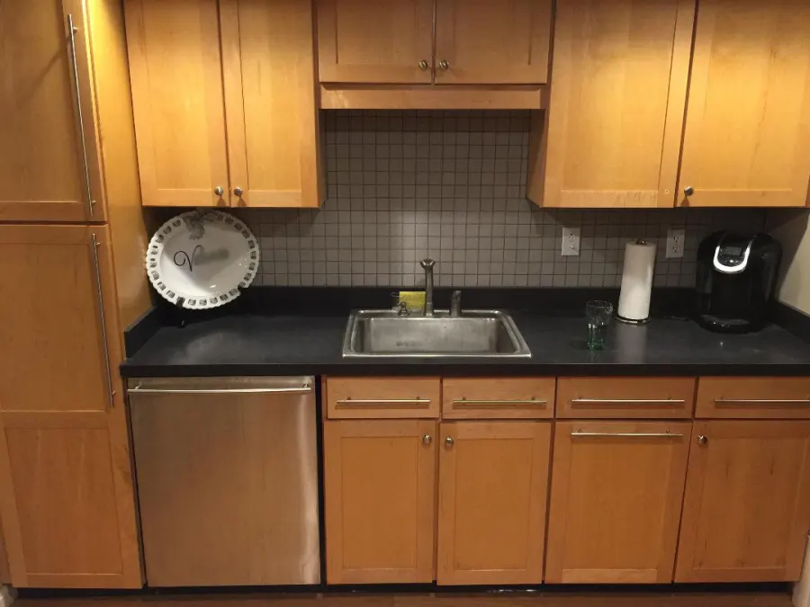 Remodeled kitchen with wood cabinets